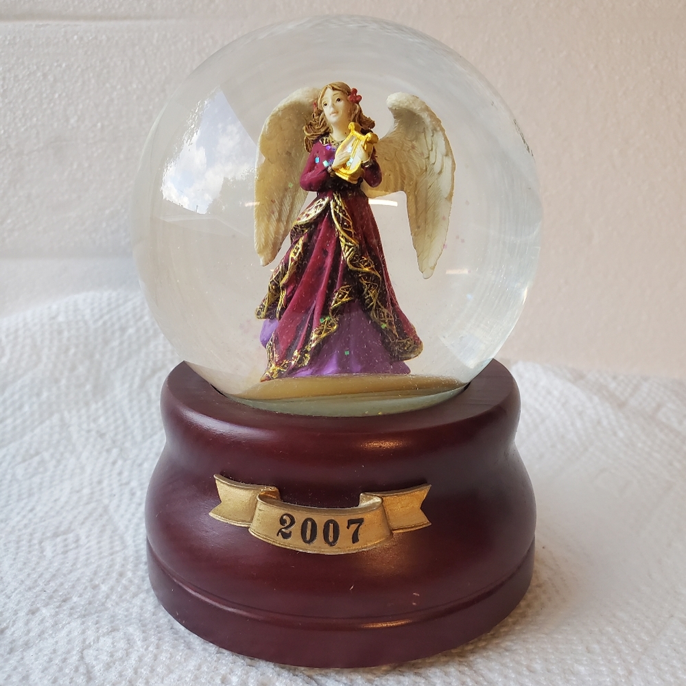 Angel Snow Globe.  This globe is a Limited Edition collector's item.  Dimensions